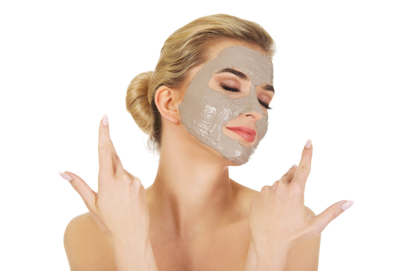 Young happy woman with facial mask, isolated on white.